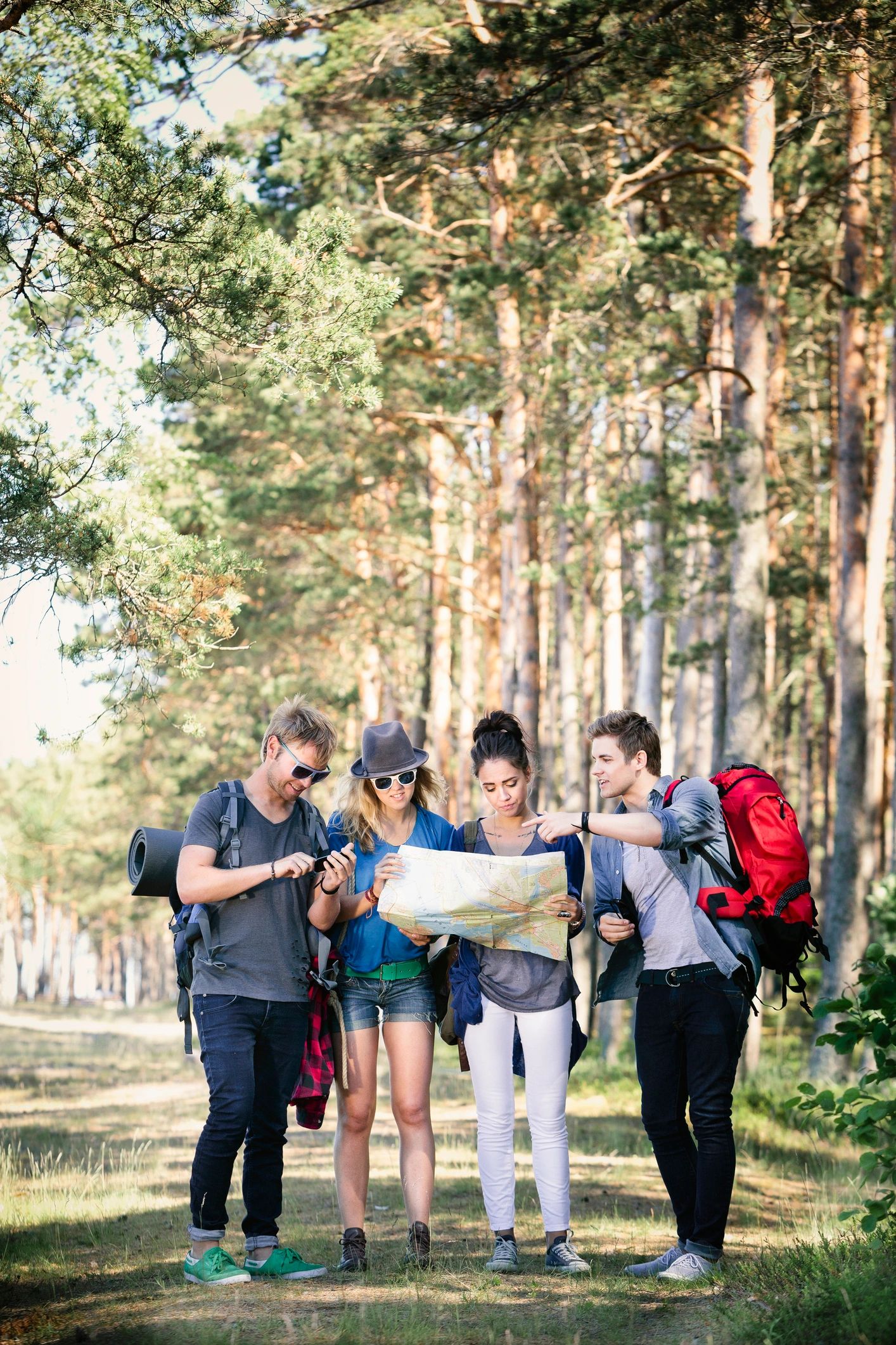 Small group of travelers planning an outdoor adventure together